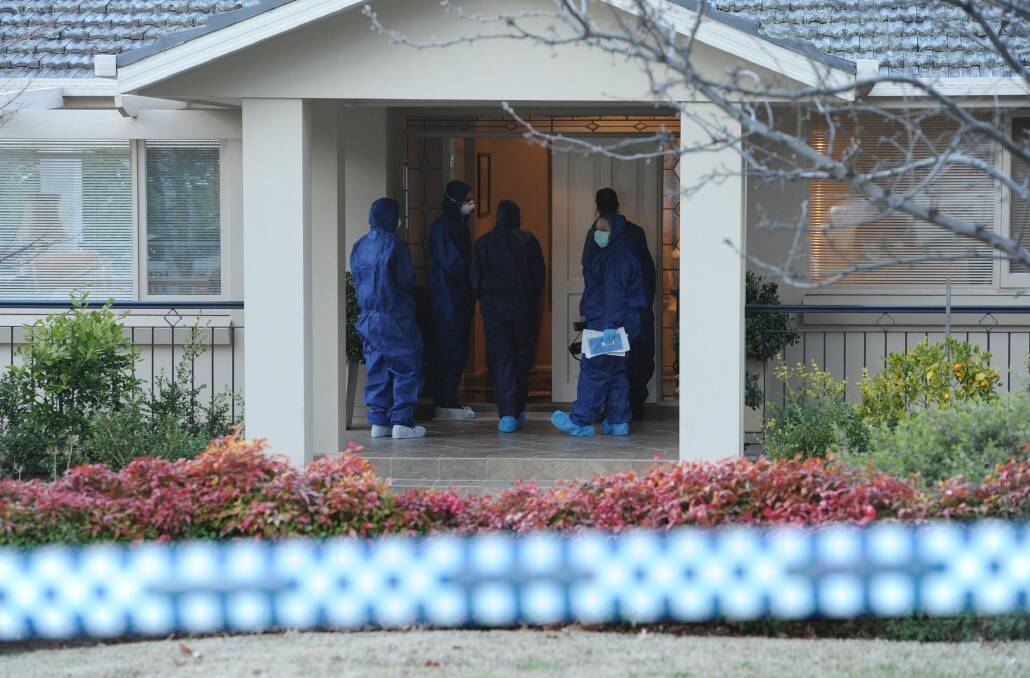 Police inspect the Mugga Way home where Terrence Freebody was murdered. Photo: Graham Tidy
