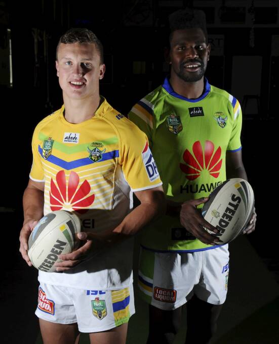 Jack Wighton and Edrick Lee model the Raiders' 2015 away and home jerseys respectively. Photo: Graham Tidy