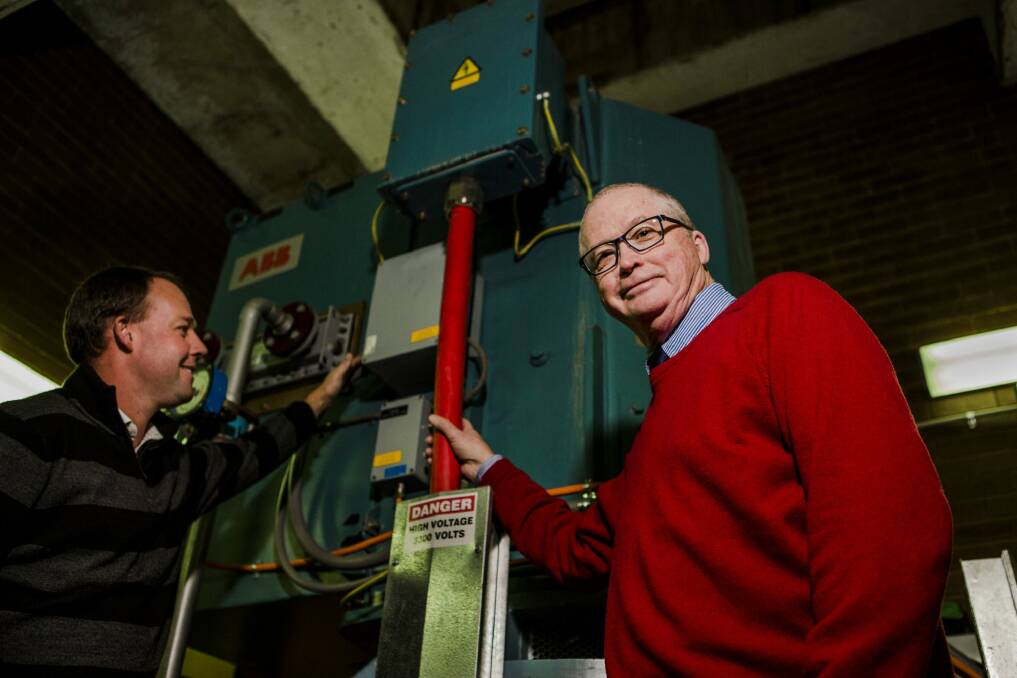 Asset manager Jason Brown, and chief executive of National Capital Authority  Malcolm Snow give a rare insight into the Captain Cook memorial jet pump house on Monday. Photo: Jamila Toderas