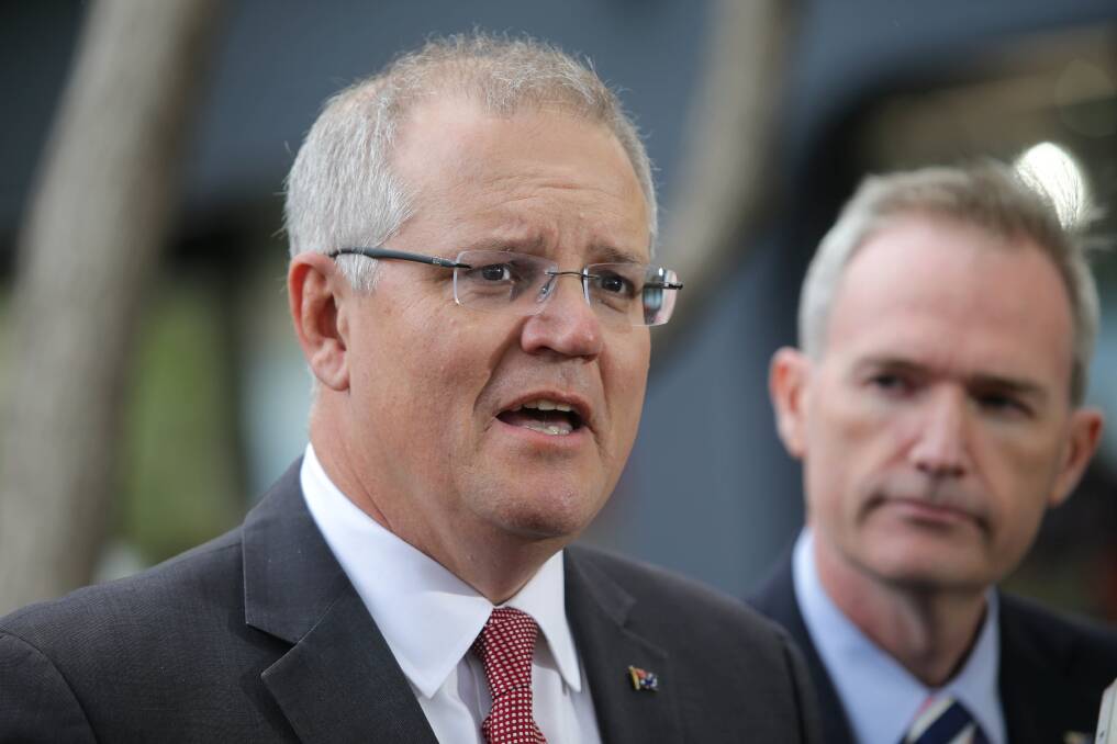 Prime Minister Scott Morrison and Immigration Minister David Coleman are connected to a bidder for a major government contract. Photo: John Veage