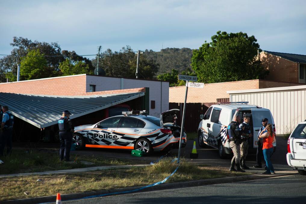 A car port collapsed and a police car was rammed at a home in Kambah. Photo: Rohan Thomson