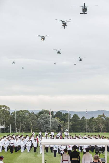 Australian Defence Force Academy year one officer cadets and midshipmen parade as the army and navy helicopters fly past.  

 Photo: Matt Bedford