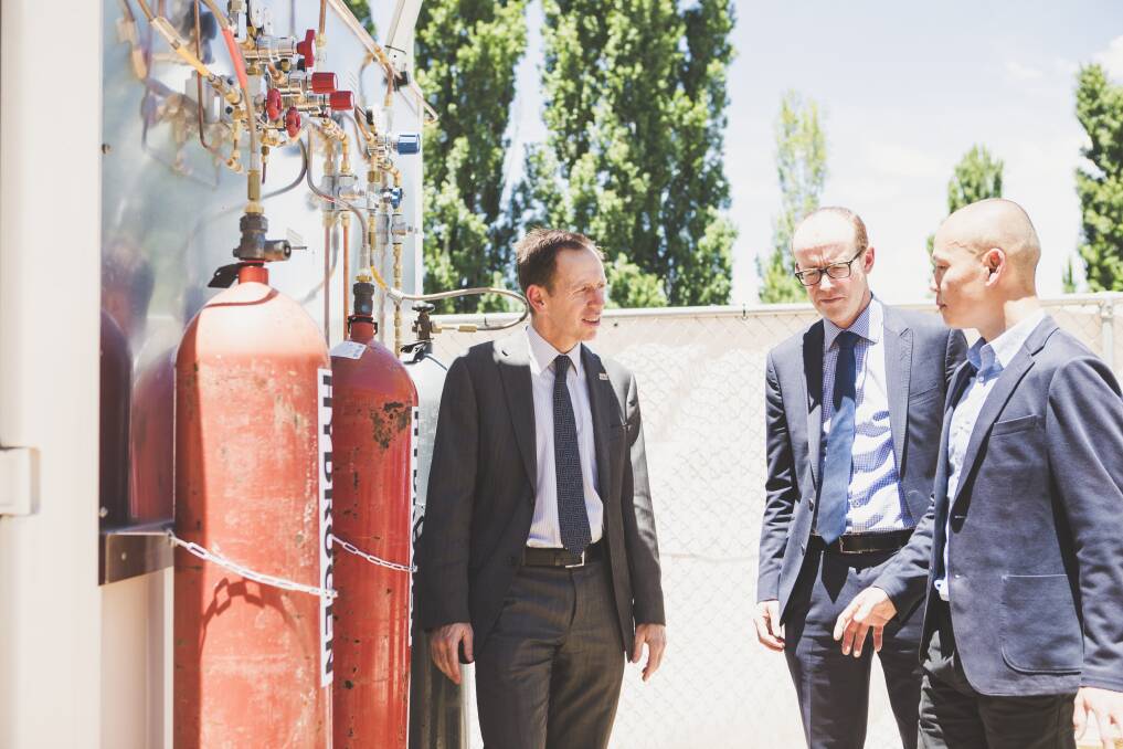 From left: Minister for Climate Change and Sustainability Shane Rattenbury, Energy Networks Australia's Andrew Dillon, and Evoenergy gas networks manager William Yeap at the opening of a hydrogen gas test facility.  Photo: Jamila Toderas