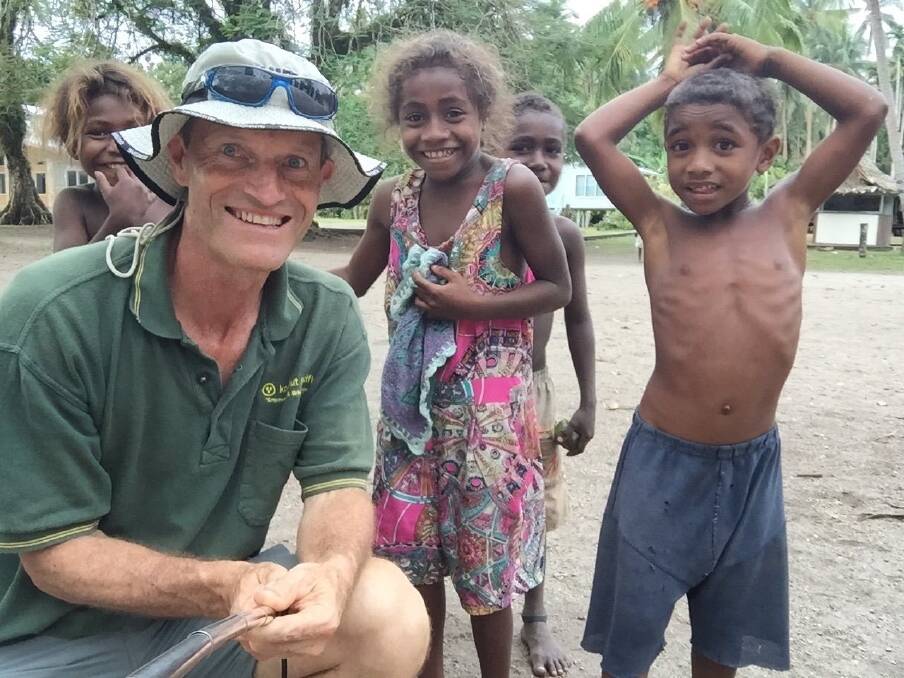 Kokonut Pacific's Richard Etherington with children in the Solomon Islands. Photo: Supplied