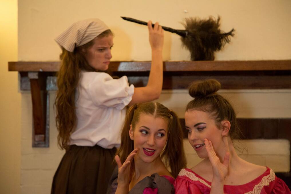 (From left) Cinderella (Adellene Fitzsimmons) is put to work by stepsisters Joy (Risa Craig) and Grace (Holly Ross). Photo: Donna Larkin