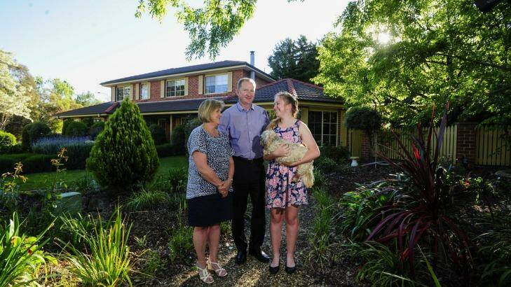 On the market: David and Helen Maybin with their daughter Tara, 15 are selling their family home in Fadden. Photo: Melissa Adams