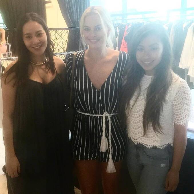 Catlina Vera Vera (left) and Taylor Cichacz (right) with actress Margot Robbie at Rebel Muse in Braddon.  Photo: Supplied
