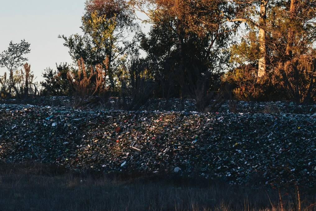 The piles of glass from ACT recycling bins dumped near the Federal Highway at Lake George. Photo: Rohan Thomson