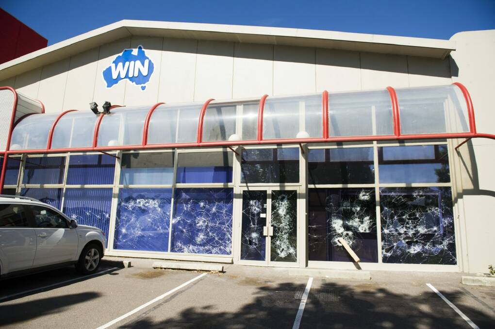 Smashed windows at the WIN TV building on Wentworth Ave, Kingston Photo: Jay Cronan