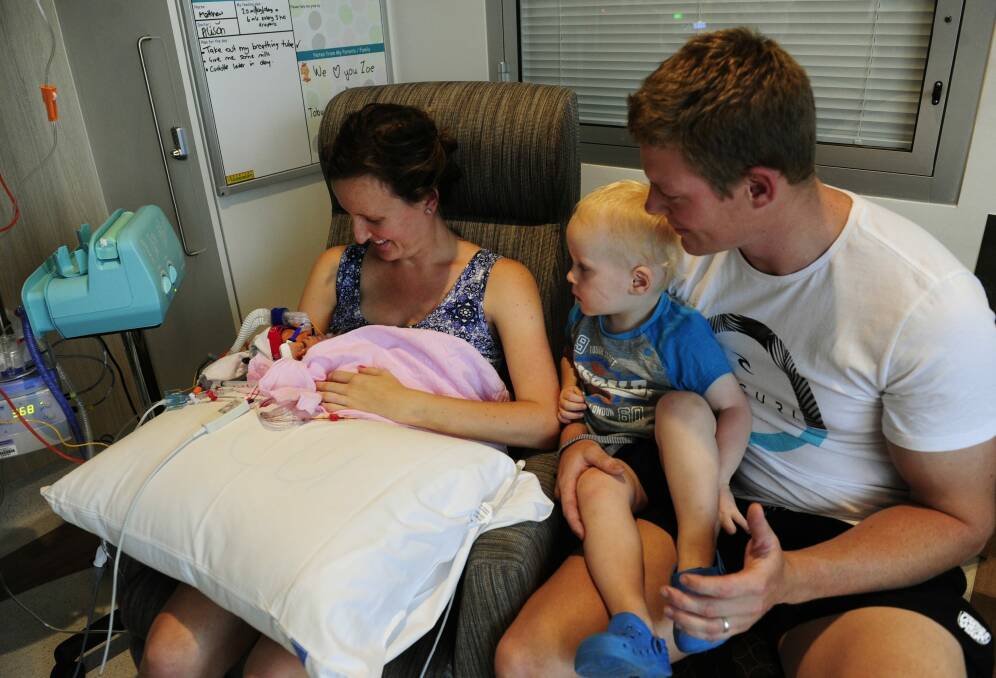 The Wilson family of Cowra in the Neonatal Intensive Care Unit at the Centenary Hospital for Women and Children at the Canberra Hospital campus. Lauren and Chris are with their two children, Toby, 22 months, and Zoe, who was born at 32 weeks.  Photo: Melissa Adams