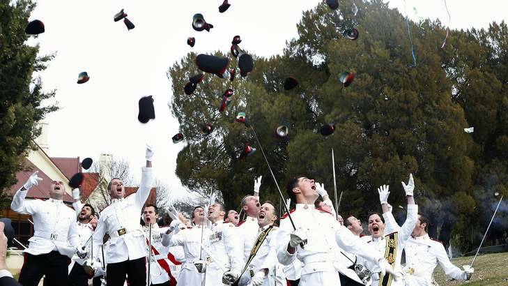 News.   Royal Military College graduates celebrate following the graduation ceremony at Duntroon.  18 June 2013 Canberra Times photo by Jeffrey Chan. Photo: Jeffrey Chan