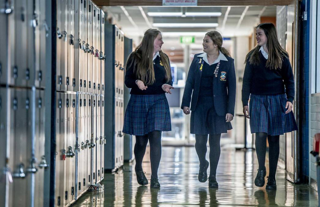 Merici college students (from left) Jade Esler, year 10, Maddison Berry, year 12 and Lucy Pembroke, year 8 talk about attending a single sex school. Photo: Karleen Minney