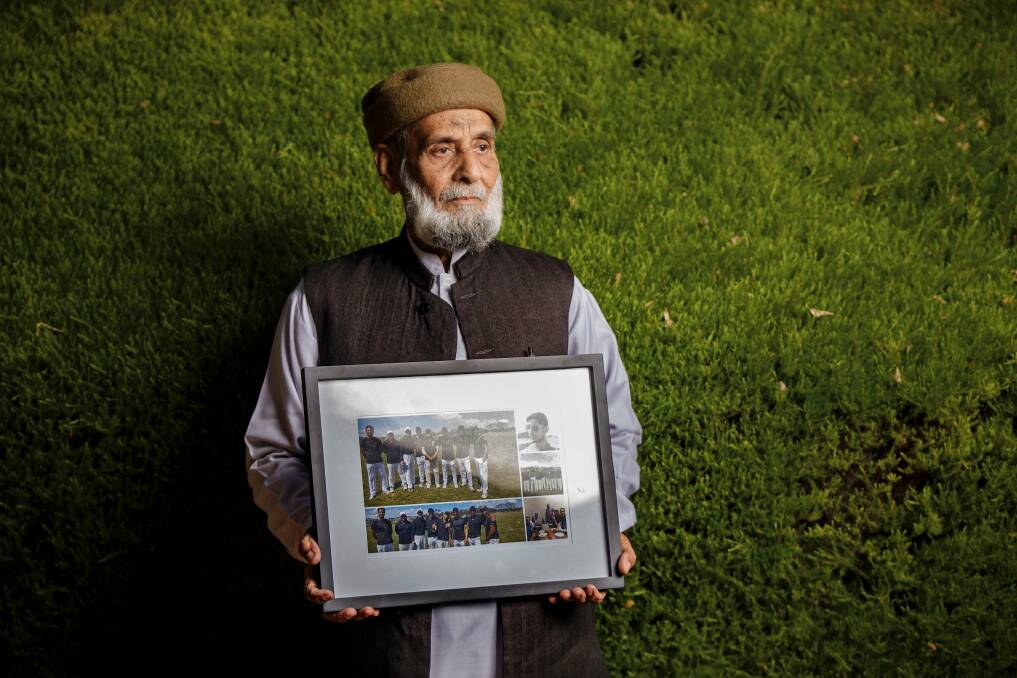 Muhammad Akbar Abbasi with photos of his son Zeeshan Akbar, who was tragically killed on April 7 while working at a service station in Queanbeyan. Photo: Sitthixay Ditthavong