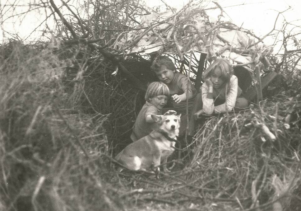 Jessica Morgan, Nicky Morgan and Jeannette Atkins (with Hilda the corgi) in a cubby on Mt Taylor in the early 1970s. Photo: John Morgan