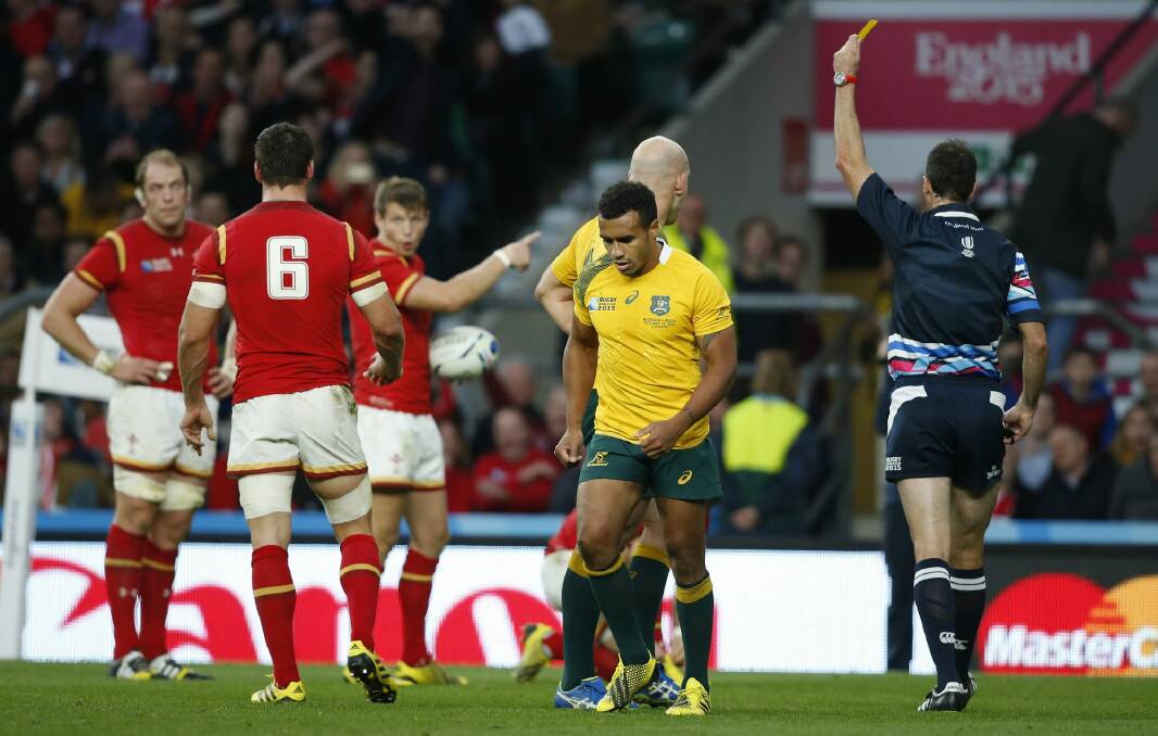 Ten in the bin: Australia's Will Genia walks from the field after getting a yellow card from referee Craig Joubert during the Rugby World Cup Pool A match between Australia and Wales at Twickenham. Photo: Alastair Grant