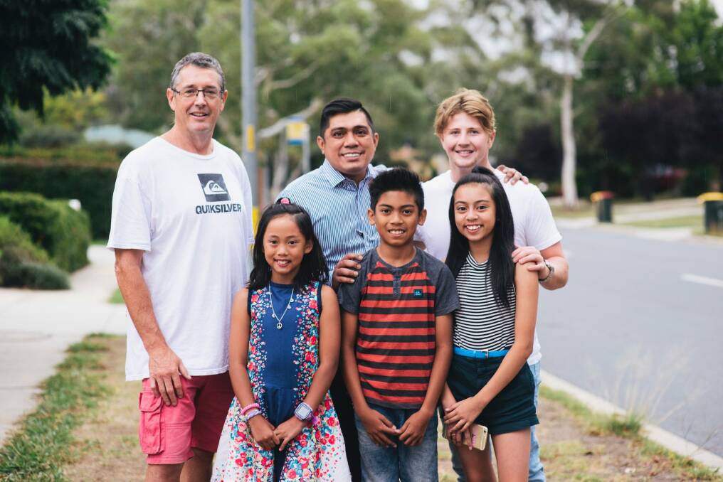 Kevin and William Nash, 16, who helped rescue Anuar Medina and three of his children, (L-R) Freja, 9, Francis, 11, and Francesca who almost drowned at the South Coast last week. Photo: Rohan Thomson