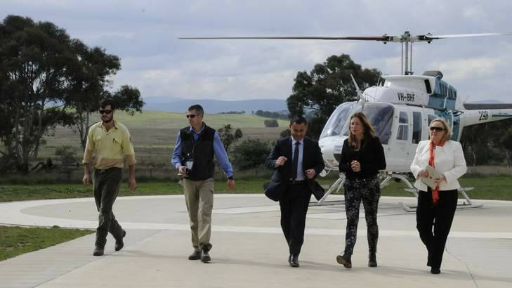 Monaro MP John Barilaro, centre, ACT Member for Ginninderra Yvette Berry, 2nd right and Yass Valley Mayor Rowena Abbey, right, after surveying hot spots for illegal dumping from the sky as part of an ACT/NSW multi million dollar joint initiative. Photo: Georgina Connery
