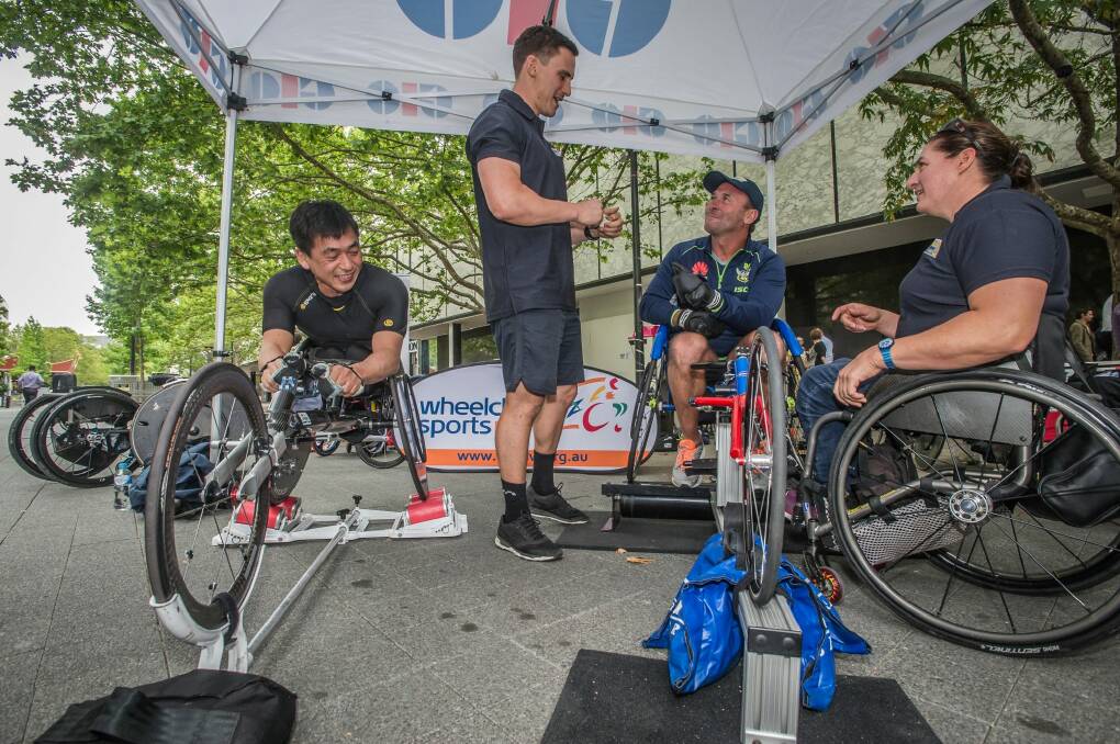 Ricky Stuart gets tips at the launch of the Wheelchair Sport Summer Down Under series in Canberra on Thursday. Photo: Karleen Minney