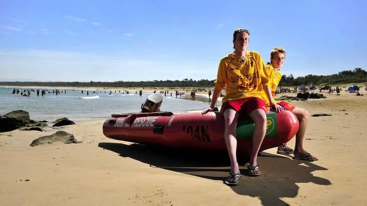 READY TO HELP: Sam Pettigrove, 23, and his brother Ted, 16, of Kambah, on patrol at Broulee beach. ''It's a lovely beach, safe, fairly friendly and gets some good surf,'' Sam Pettigrove said. Photo: Jay Cronan