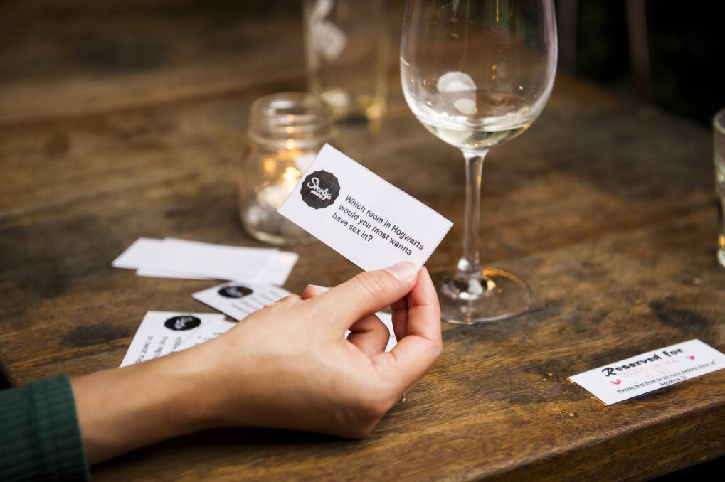 Ice breaker cards are on the tables to help spark conversation. Photo: Dion Georgopoulos