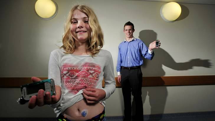 Ellen Brown, 11, and Liam Shanahan show off the latest technology to help people manage their diabetes. Photo: Jay Cronan