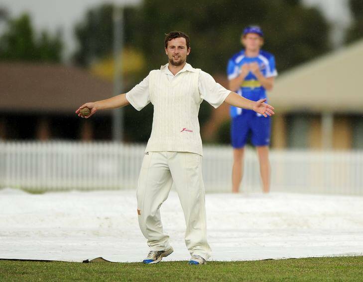 Queanbeyan's Vele Dukoskin does his best impression of a rain dance during a break in play.