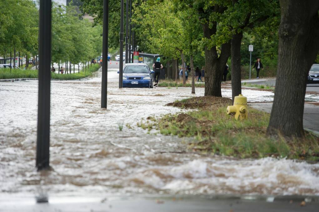 A water main bursts on Constitution Ave in Canberra. Photo: Jay Cronan
