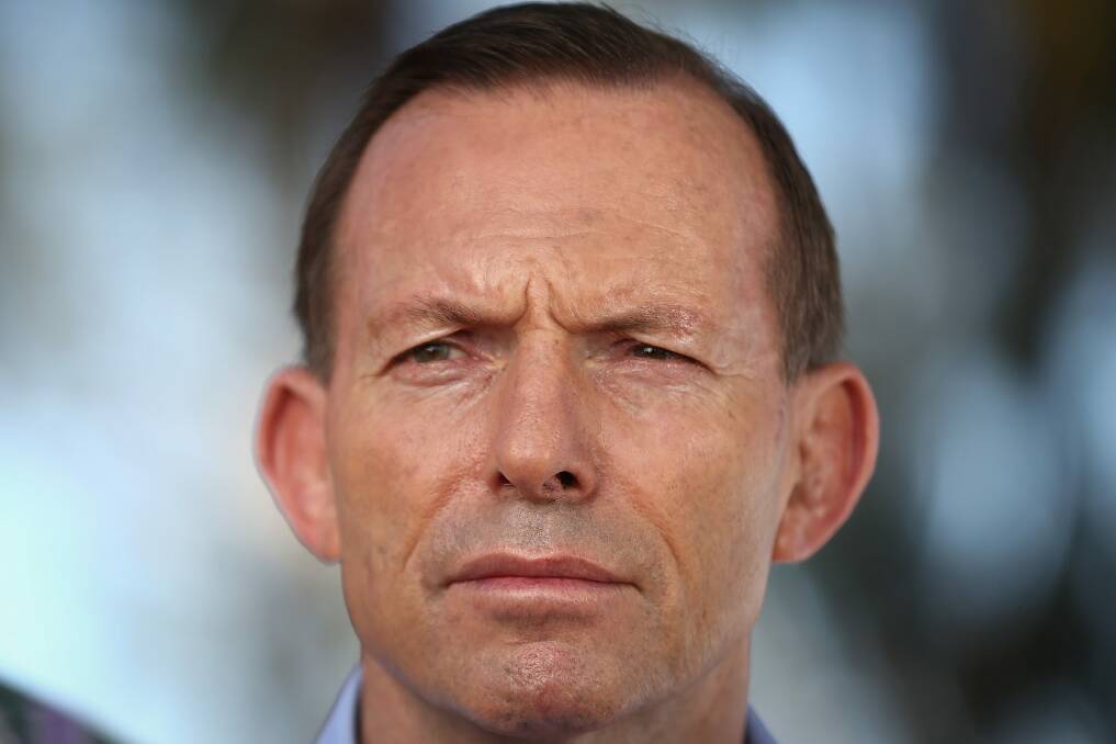 Prime Minister Tony Abbott says the royal commission should go on with or without Mr Heydon. Photo: Alex Ellinghausen