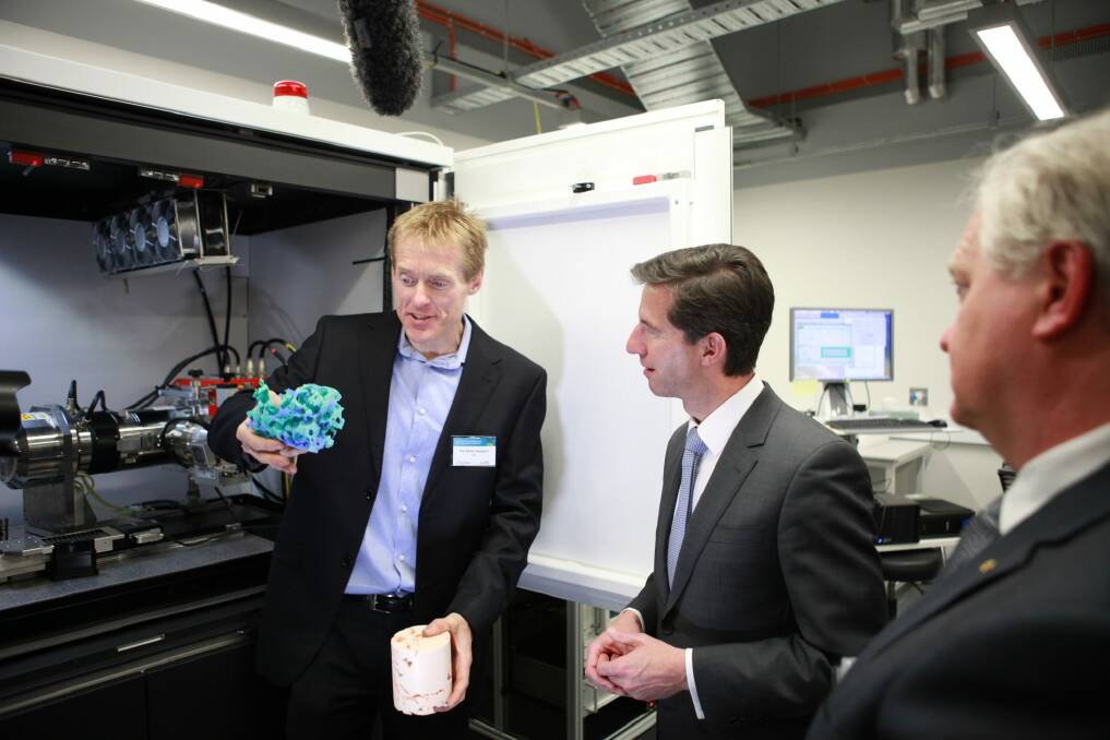 Associate Professor Adrian Sheppard, the Head of the ANU Department of Applied Mathematics, left, shows Minister for Education Simon Birmingham, a 3D model of rock formations at the opening of the refurbished CTLab. Photo: Jamie Kidston, ANU