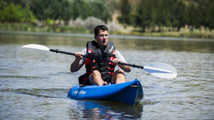 Zed Seselja kayaking on Lake Tuggeranong before heading to Batemans Bay for a much-needed holiday with his family. Photo: Rohan Thomson