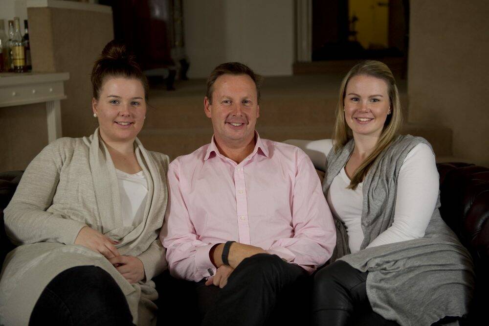 Rod Sutherland with his daughters, Clare, 19, and Jane Sutherland 23. Photo: Jay Cronan