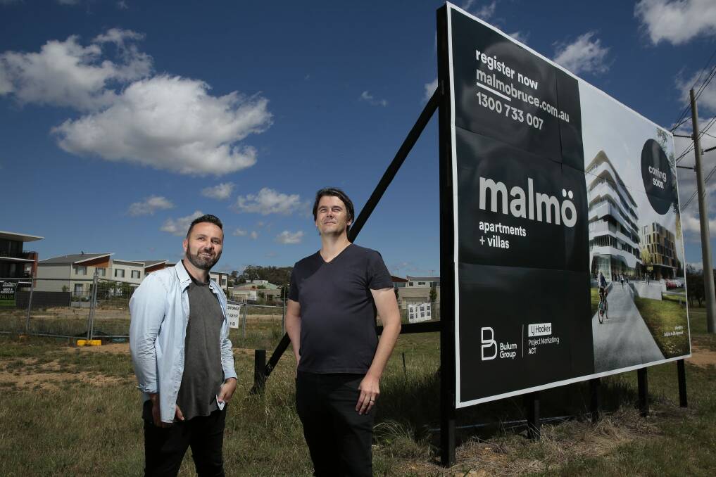 From left, developer/creative director Nik Bulum and architect Nathan Judd in front of the site of the future Malmo apartment and commercial development near the intersection of Ginninderra Drive and Braybrooke Street in Bruce.   Photo: Jeffrey Chan