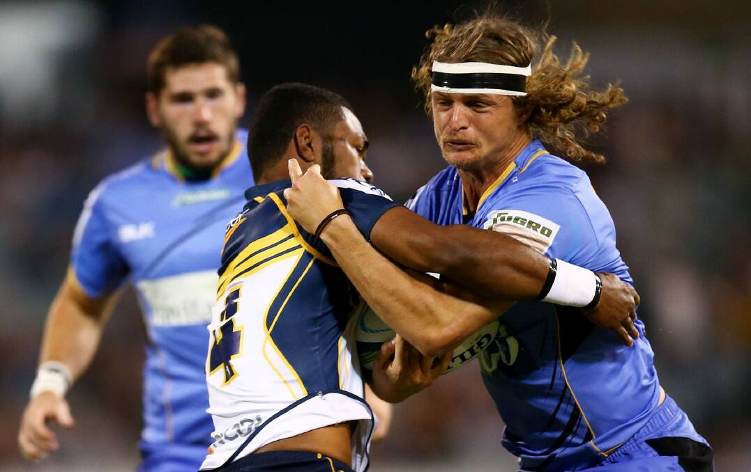 Far enough: Brumbies winger Henry Speight stops Force counterpart Nick Cummins during a match earlier this year. Photo: Getty Images