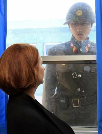 Australia's Prime Minister Julia Gillard and a North Korean soldier look at each other at the U.N. Command Military Armistice Commission meeting room in the demilitarized zone separating the two Koreas in April 24, 2011. Photo: Reuters