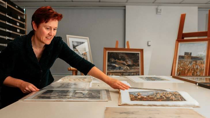 War memorial senior curator Claire Baddeley with some of the works donated by William Edwin Pidgeon's family. Photo: Katherine Griffiths
