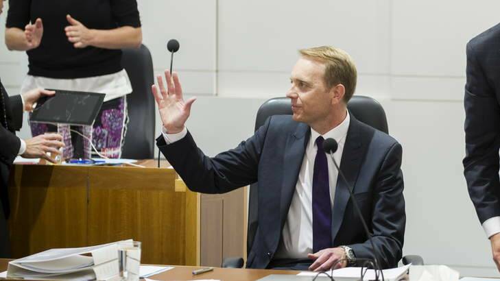 Simon Corbell acknowledges a standing ovation from the public gallery after introducing the Marriage Equality Bill in the ACT Legislative of Assembly in September. Photo: Rohan Thomson