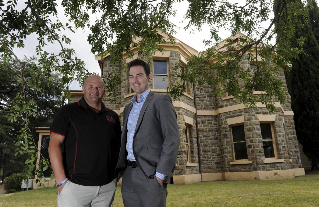 Soldier On volunteer Todd Berry, left, with the charity's chief executive and co-founder John Bale at the organisation's new headquarters at the former CSIRO Sustainable
Ecosystems stone building in Crace.  Photo: Graham Tidy 