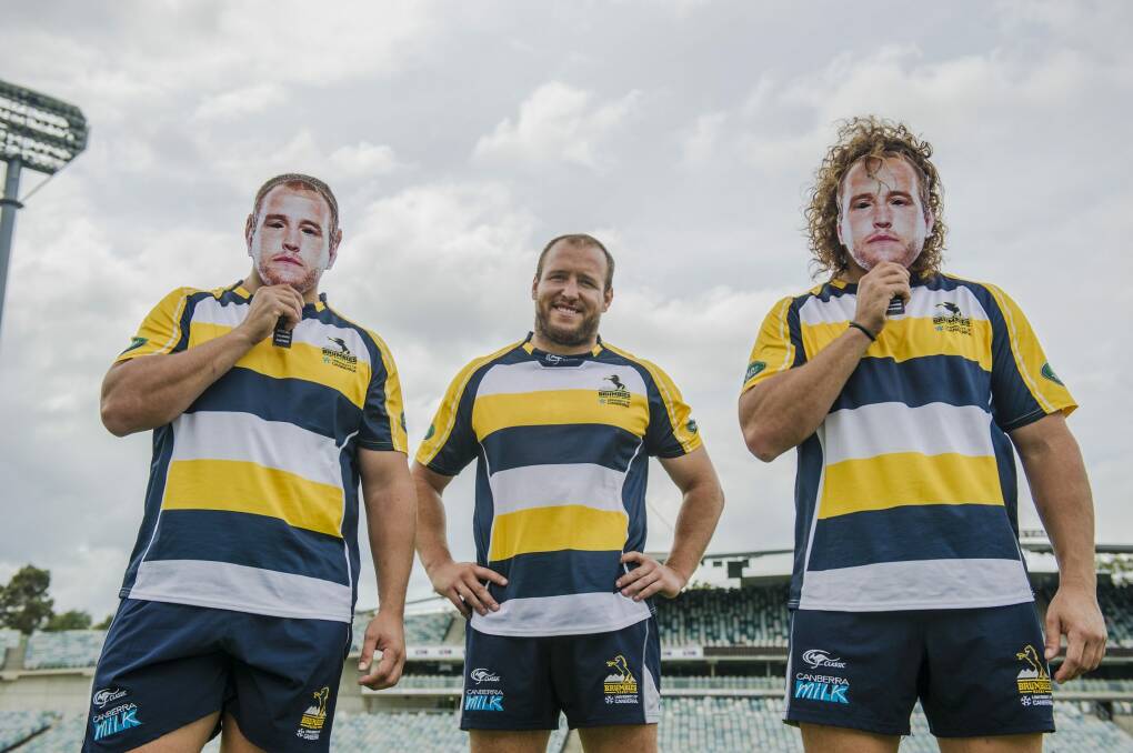 Brumbies players Ruan Smith and Jean-Pierre Smith wear Ben Alexander face masks ahead of Alexander's 100th match.  Photo: Jamila Toderas
