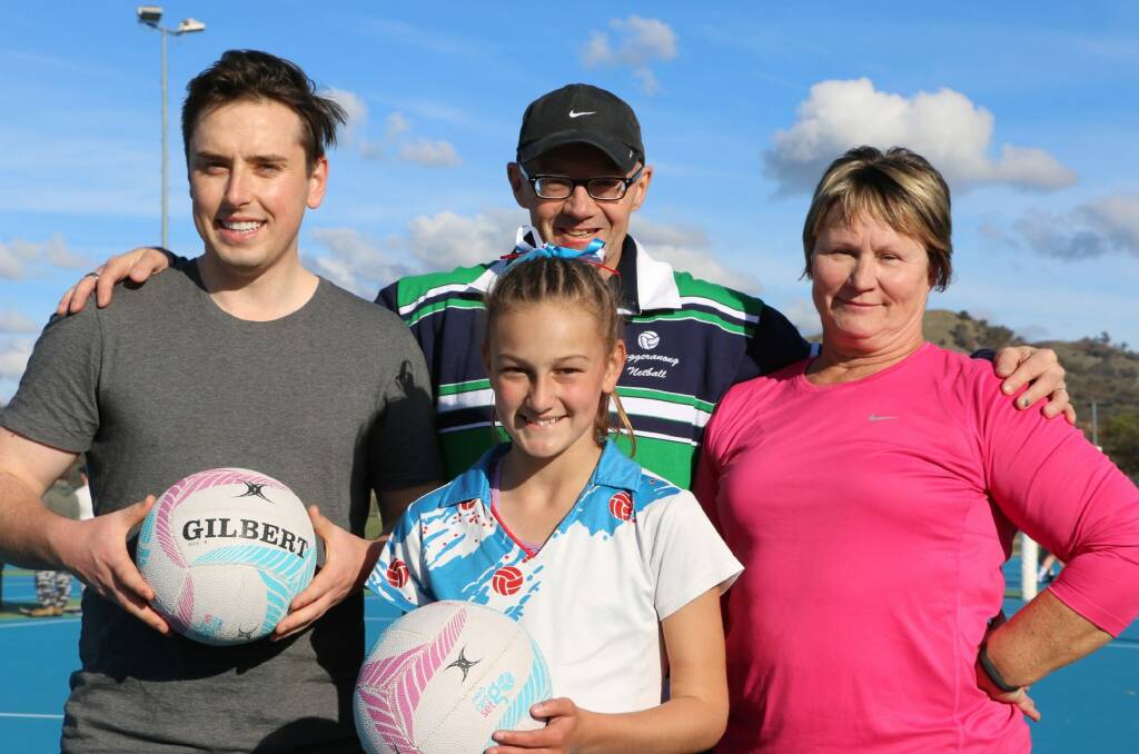 Michael Pettersson, left, and Nicole Lawder, right, received netball skills training at the Calwell netball courts  as part of their preparation for TNA Turns Pink 3 charity event on June 17 , from Tuggeranong Netball's head coach, Matt Hills, centre, watched on by Nicole's grand-daughter, Annabelle Adcock, who plays for the Rebels Netball Club and represents Tuggeranong in junior representative netball. Photo: David Sibley