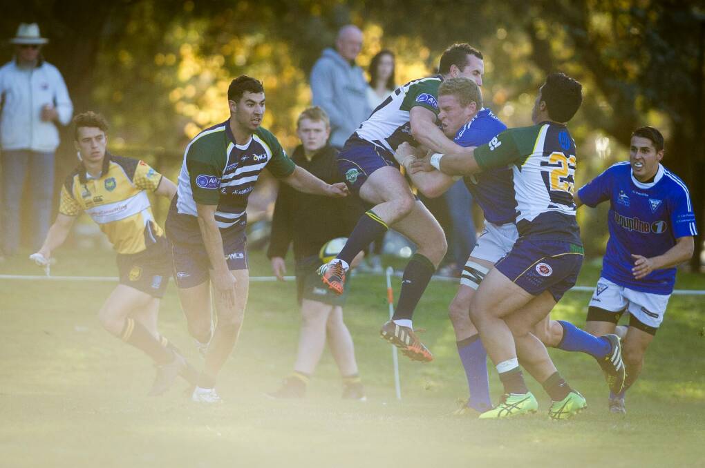 Tom Cusack can't quite make it to the try line.  Photo: Dion Georgopoulos