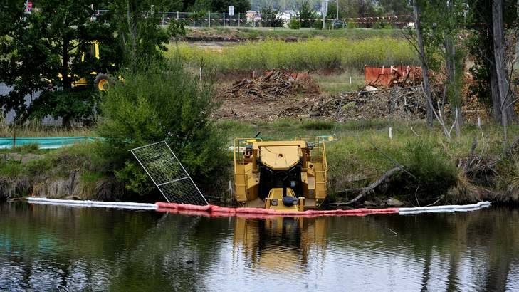 A bulldozer has been submerged in water at the Molonglo River what is thought to be an act of vandalism . Photo: Melissa Adams