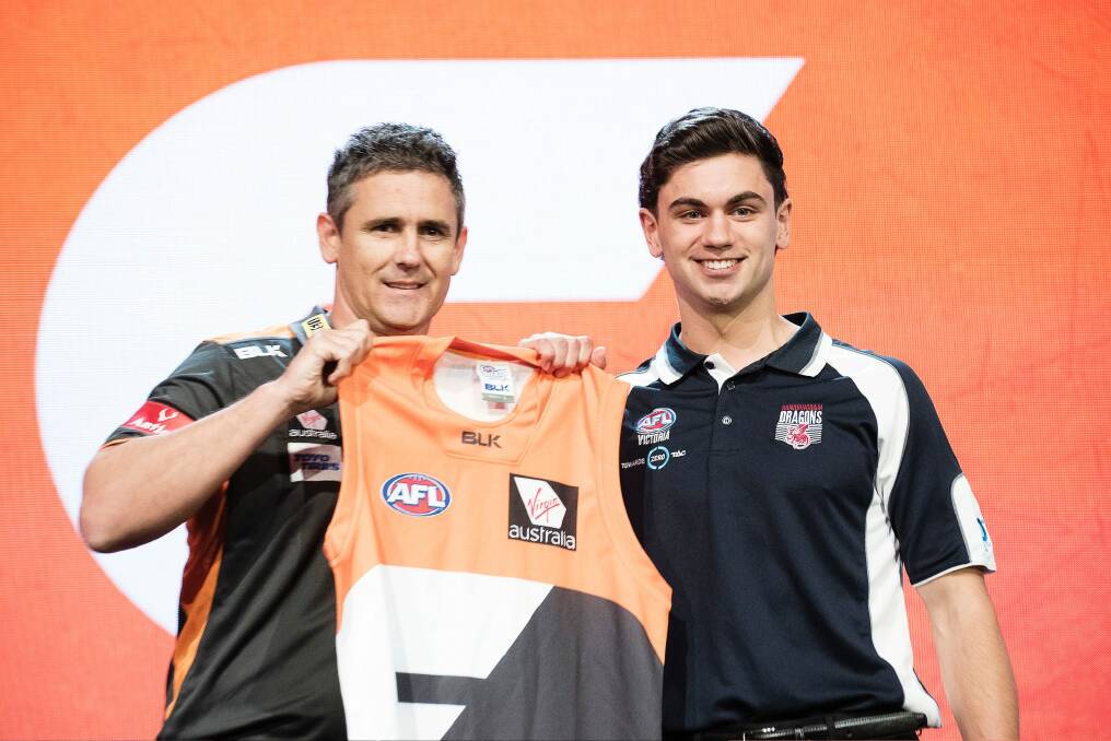 GWS Giants coach Leon Cameron poses with the number two draft pick TIm Taranto. Photo: Christopher Pearce