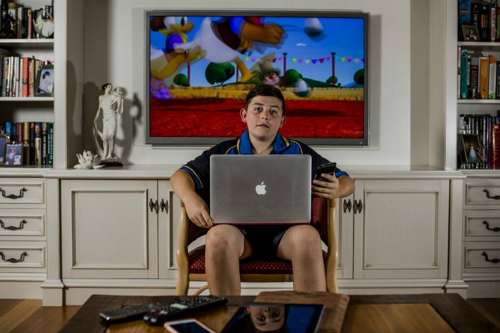 Hamish Insley, 12, has a variety of devices he uses to access the internet. Photo: Jamila Toderas