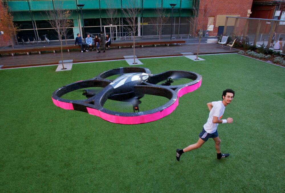 Chad Toprak, photographed with his jogging buddy, an autonomous robot drone helicopter. Photo: Craig Sillitoe 