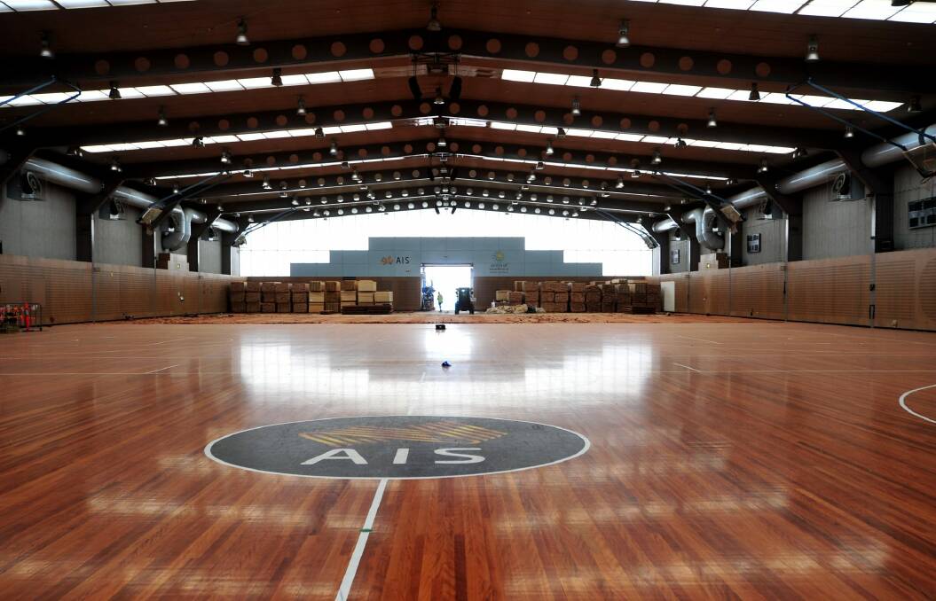 The AIS is replacing 30 years of basketball and netball history with new floorboards in a $750,000 renovation. Photo: Melissa Adams