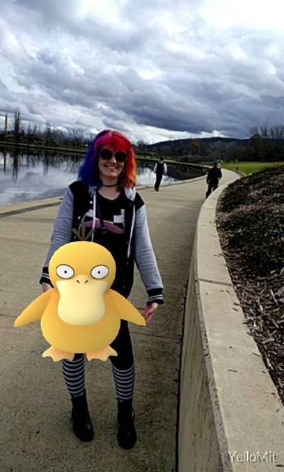 Gemma Bolton posed with this Psyduck on the shores of Lake Burley Griffin. Photo: Gemma Bolton