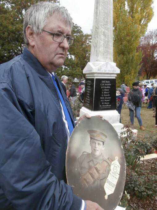 Mark Ellery, the writer's brother, who was named after the Ellery brothers's father, Mark Pascoe Ellery, with a picture of Gunner Stephen Ellery at the re-dedication of the Neville war memorial on April 19, 2015. Stephen and Joe are listed on the plaque immediately behind him. John Ellery is listed separately. Samson Ellery is not listed on the memorial. 