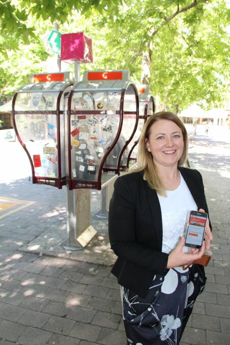 Telstra Country Wide area general manager Larissa Redford at a Wi-Fi hotspot on Alinga Street. Photo: Mark Sawa