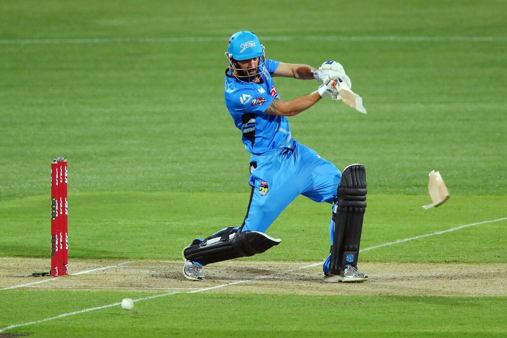 Smashed it: Jono Dean's bat splits in two as he connects with a shot in the Strikers' victory over the Hurricanes. Photo: Getty Images
