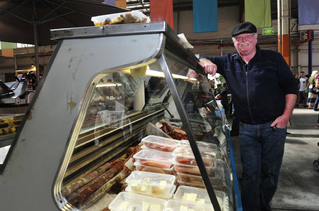 Say cheese: Old Bus Depot Markets stallholder Bryan Loader has been operating his stall Mr Cheese since day one of the markets in 1994. Photo: Melissa Adams